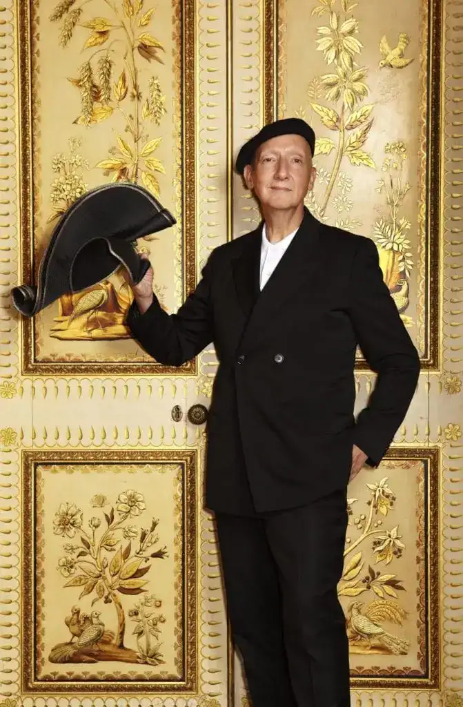 Stephen Jones in The Saloon of the Royal Pavilion holding ‘Royal Crescent’ from his Chinoiserie on Sea collection inspired by Brighton and the Royal Pavilion, S/S 2012