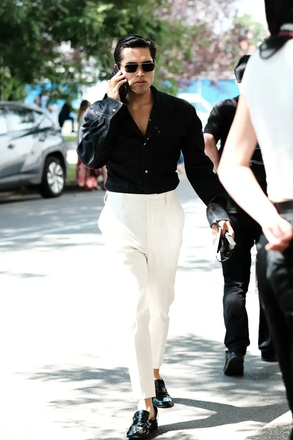 A guest in Prada during Milan Fashion Week Menswear 2025 Spring/Summer by Agnes Select