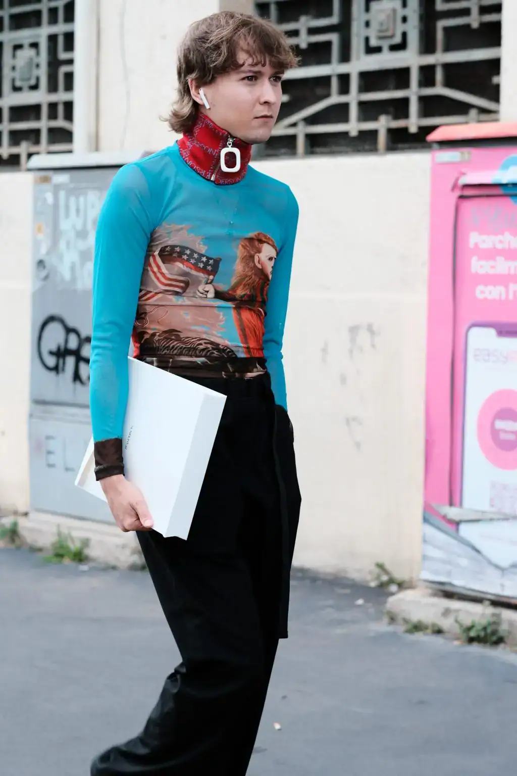 A guest arriving at JW Anderson 25ss show during MFW by Agnes Select