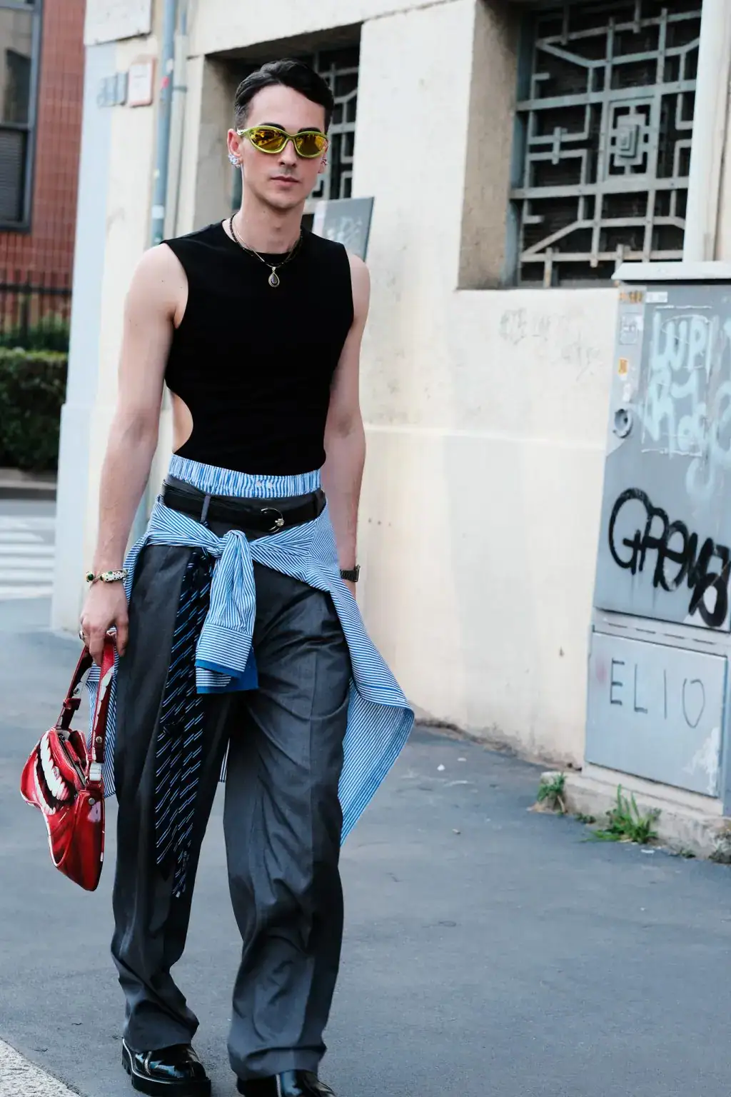 A guest arriving at JW Anderson fashion show during Milan Fashion Week Men's 2025 Spring Summer
