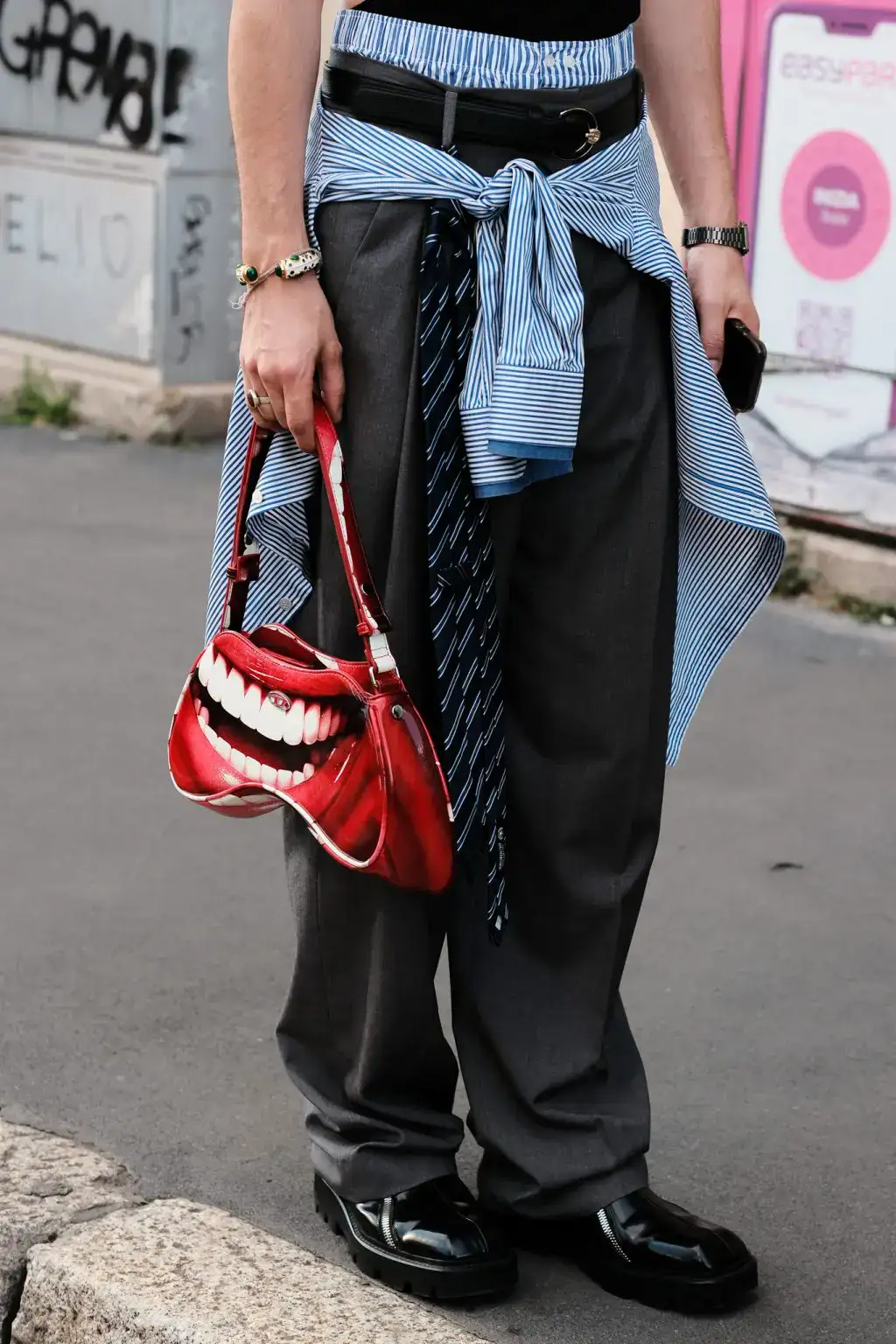 A guest arriving at JW Anderson fashion show during Milan Fashion Week Men's 2025 Spring Summer
